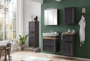 Moderner Badezimmer-Unterschrank in dunklem Holzton, frontal betrachtet, mit stilvollem Waschbecken und grüner Wand im Hintergrund.