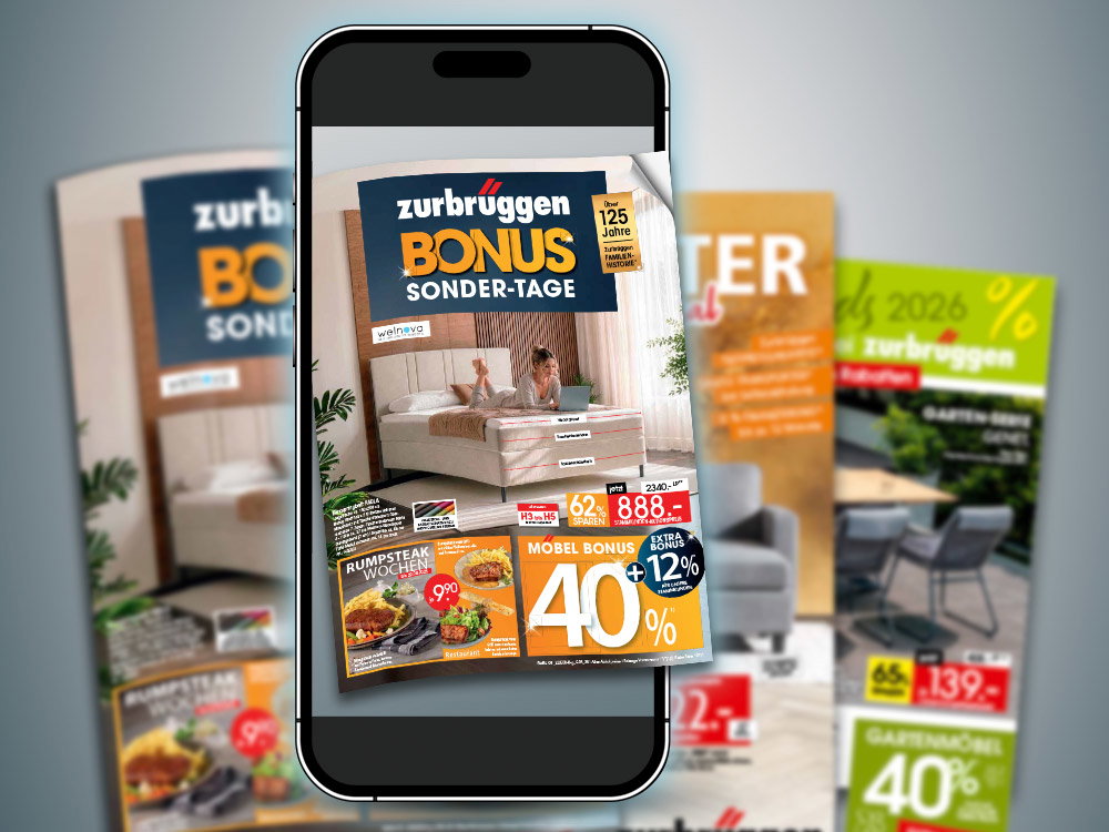 Folders van de zurbrüggen Bonus-Sonder-Tage en smartphone met digitale folder op donkere achtergrond.