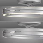 Moderne Deckenleuchte PURE Loop in silberner Optik, seitliche Perspektive mit leuchtendem LED-Ring.