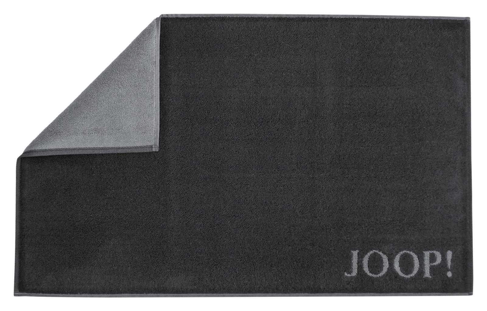 JOOP! Badematte DOUBLEFACE in dunklem Grau, Draufsicht mit umgeschlagener Ecke, zeigt das zweifarbige Design.