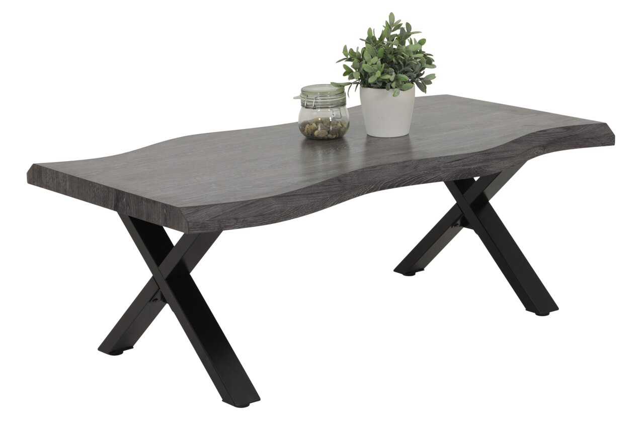 Moderner Couchtisch mit wellenförmiger grauer Tischplatte und schwarzen X-förmigen Beinen, seitliche Perspektive.