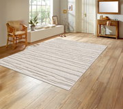 Licht, rechthoekig tapijt in crème/beige met een subtiel golfpatroon op een houten vloer in een gang/woonkamer, gefotografeerd vanuit een schuin bovenaanzicht (licht van bovenaf).
