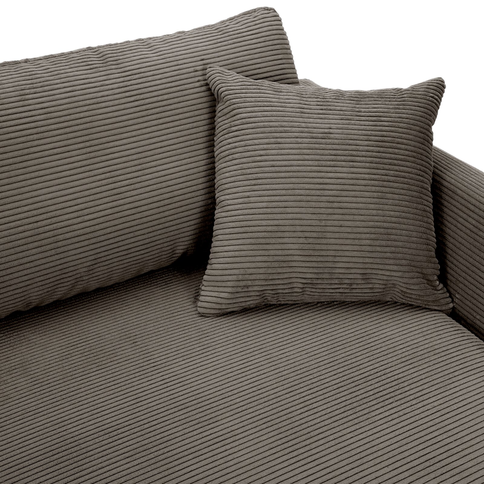 Close-up van een grijze ronde hoekbank met geribbelde bekleding en bijpassend kussen.