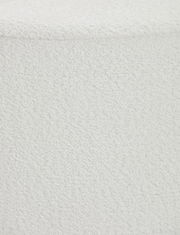 Nahaufnahme eines weißen Hockers mit texturierter Oberfläche, von oben betrachtet.