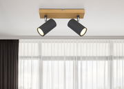 Deckenstrahler aus Metall in Graphit dunkel mit zwei verstellbaren Leuchten, montiert auf einer Holzplatte, Perspektive von unten.