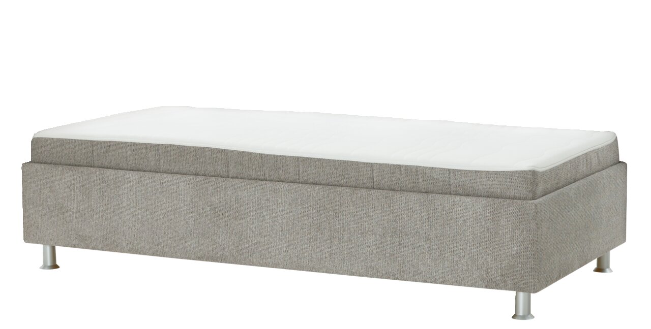Beldomo Sleep Slaapbank zonder ombouw SANDRO Een gestoffeerde ligbank zonder aanpassingen, gezien vanaf de zijkant, met een grijze stoffen bekleding en witte metalen poten