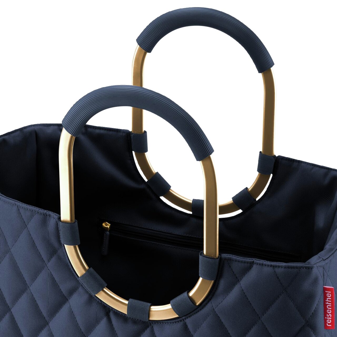 Nahaufnahme einer dunkelblauen Tasche mit gestepptem Rhombus-Muster und goldenen, ovalen Griffen mit blauen Details, Ansicht von oben.
