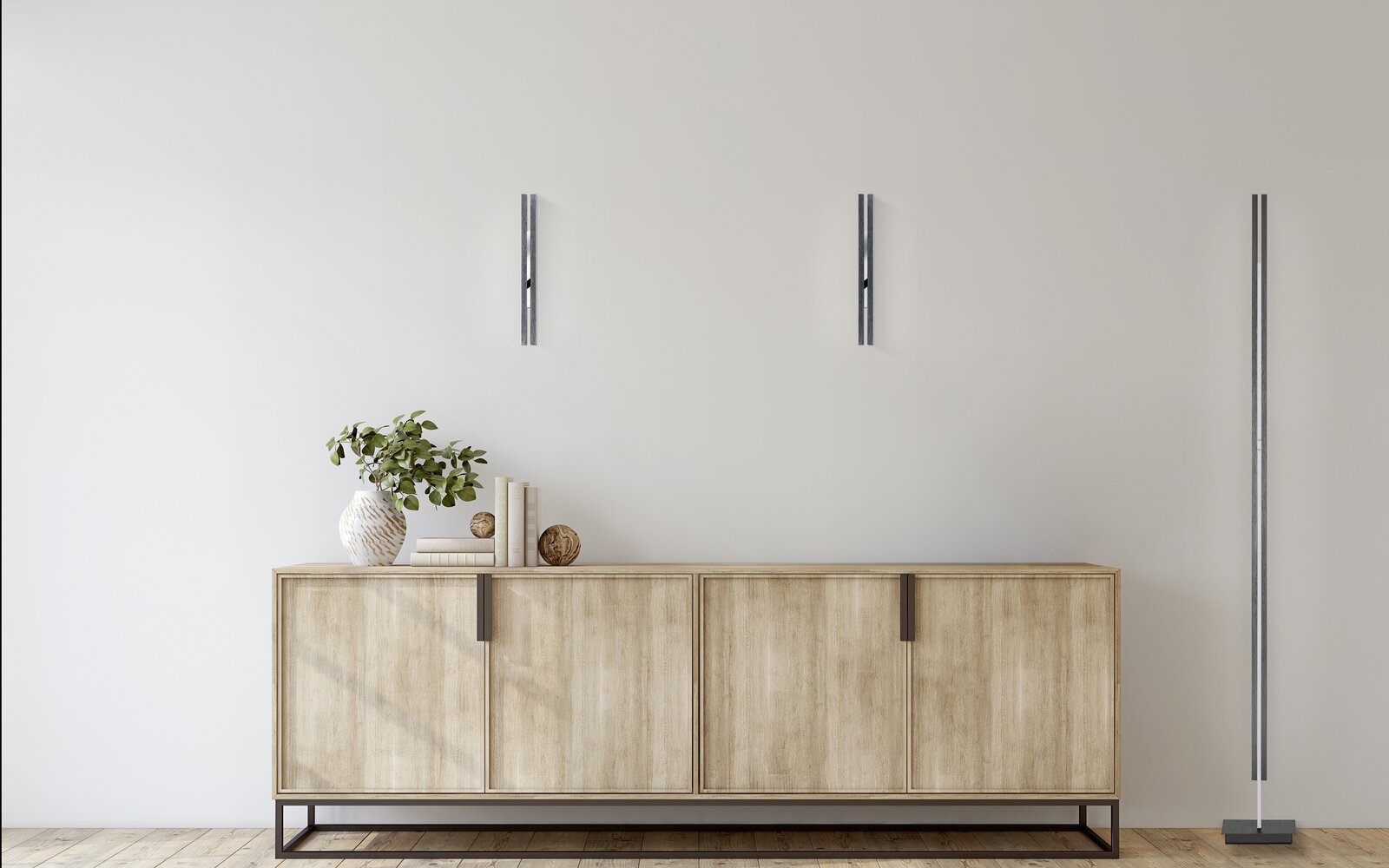 Moderne LED-Wandleuchte BEN in minimalistischem Design, frontal an einer weißen Wand über einem Holzschrank montiert.