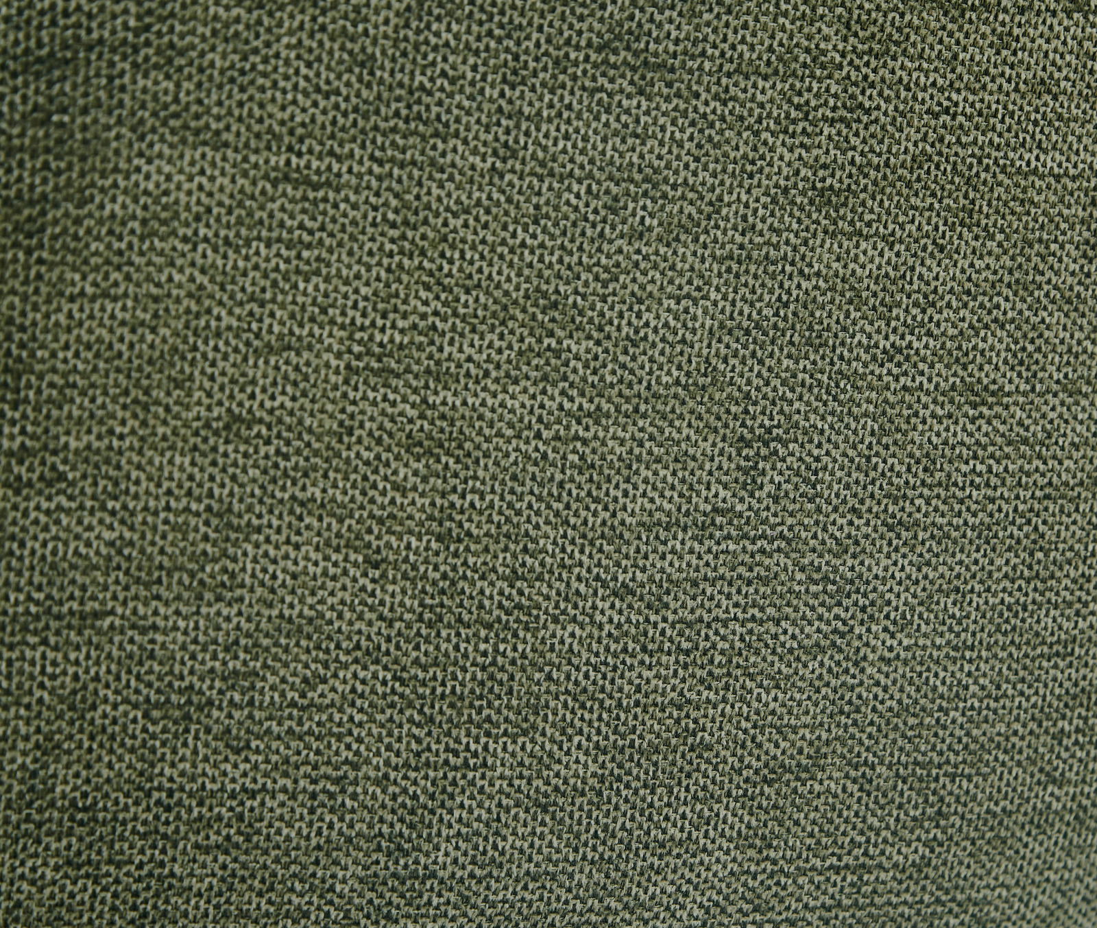 Nahaufnahme eines grünen Stoffes mit feiner Webstruktur, perspektivisch von oben betrachtet.