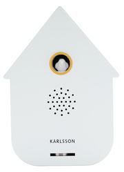 Vorderansicht einer modernen weißen Soundbox in Form eines Hauses mit einem kleinen Vogel in einem goldenen Ring und Lautsprechergitter darunter.