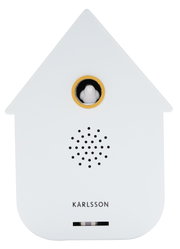 Vorderansicht einer modernen weißen Soundbox in Form eines Hauses mit einem kleinen Vogel in einem goldenen Ring und Lautsprechergitter darunter.