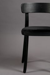 Schwarzer Holzstuhl mit gepolsterter Sitzfläche, seitliche Perspektive