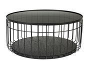 Runder Couchtisch mit schwarzem Metallgestell und Glasplatte, seitliche Perspektive