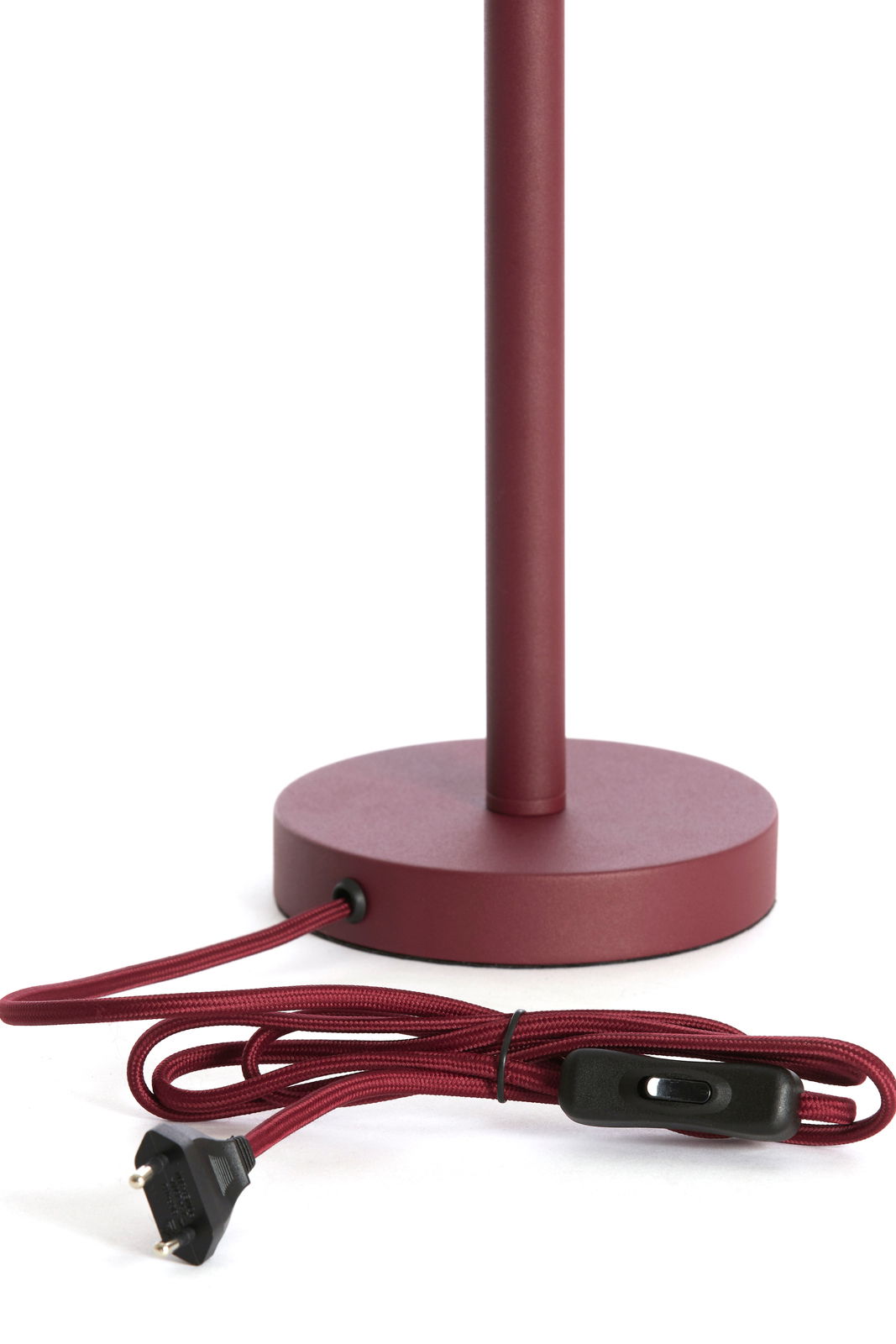 Roter Lampenfuß mit rundem Sockel und Kabel mit Schalter, seitliche Perspektive