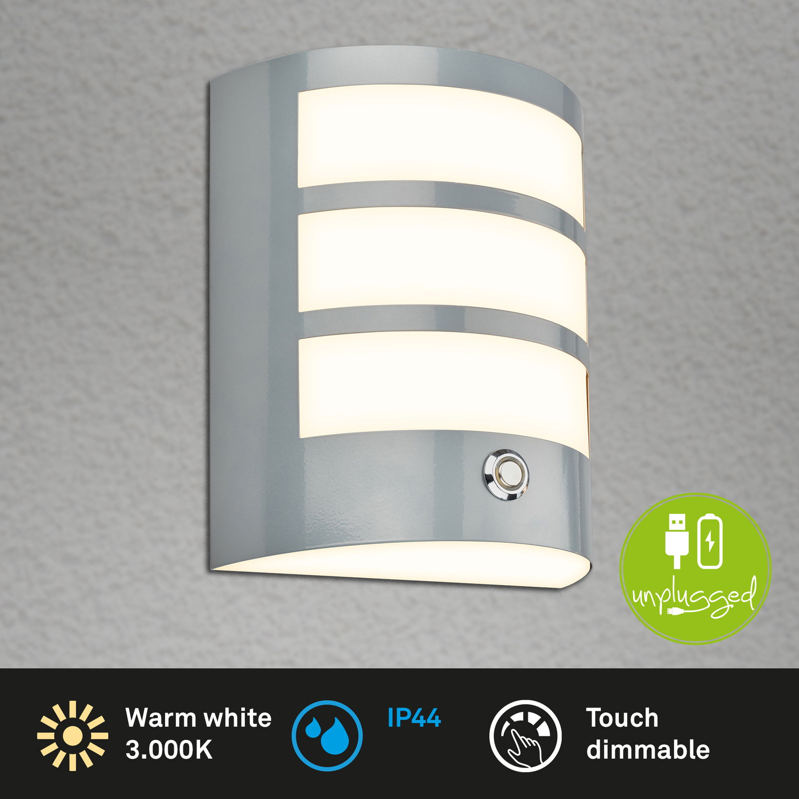 Moderne Akku-Außenwandleuchte in grauer Farbe, frontal abgebildet. Sie bietet warmweißes Licht mit 3000K, ist IP44-zertifiziert und verfügt über eine Touch-Dimmfunktion. Unplugged-Design mit USB-Ladeoption.