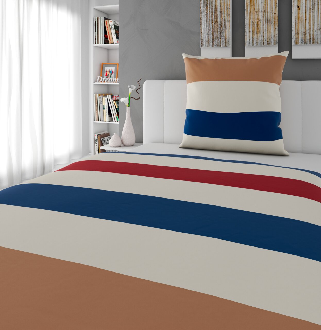 Wendebettwäsche mit breiten Streifen in Braun, Weiß, Blau und Rot auf einem Bett, fotografiert aus einer seitlichen Perspektive.