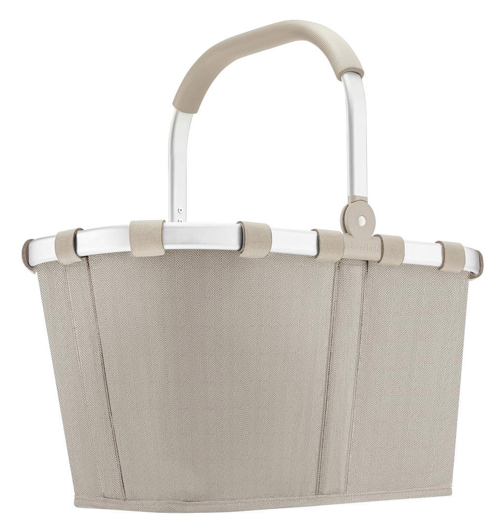 Seitenansicht eines sandfarbenen Carrybags mit Fischgrätenmuster und stabilem Griff.