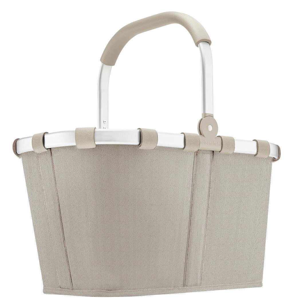 Seitenansicht eines sandfarbenen Carrybags mit Fischgrätenmuster und stabilem Griff.