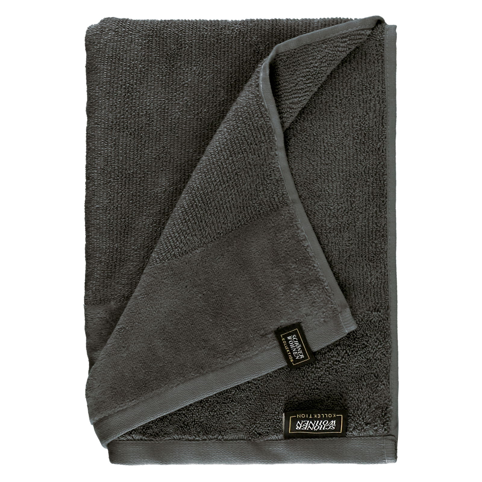 Graues Handtuchset aus Frottierstoff, gefaltet und von oben fotografiert, mit sichtbarem Etikett.