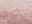 Nahaufnahme eines Designer-Teppichs in Rosa- und Beigetönen mit weicher, flauschiger Textur.