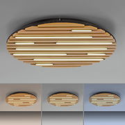 Runde Wand- und Deckenleuchte Q-AKUSTIK von Paul Neuhaus mit Holzlamellen und integrierten LED-Streifen, seitliche Perspektive.