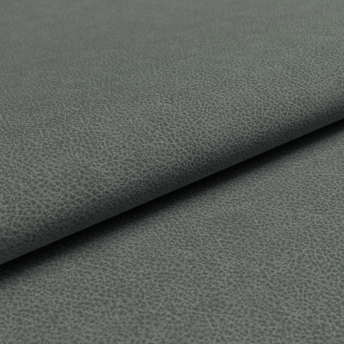 Nahaufnahme einer grauen, strukturierten Stoffoberfläche, die für Musterring Sofa MR 300 verwendet wird.