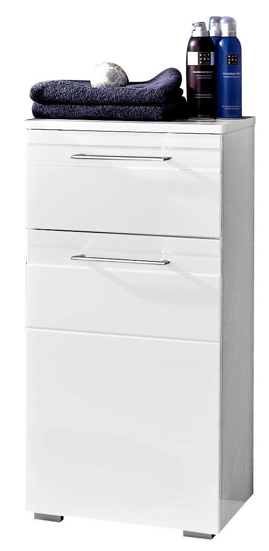 Moderner weißer Unterschrank mit drei Schubladen, darauf Handtücher und Pflegeprodukte, Frontalansicht