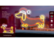 Frontalansicht einer mehrfarbig leuchtenden Lumineo LED-Neonleuchte in Dackelform mit Standfuß für den Innenbereich und USB-C-Anschluss