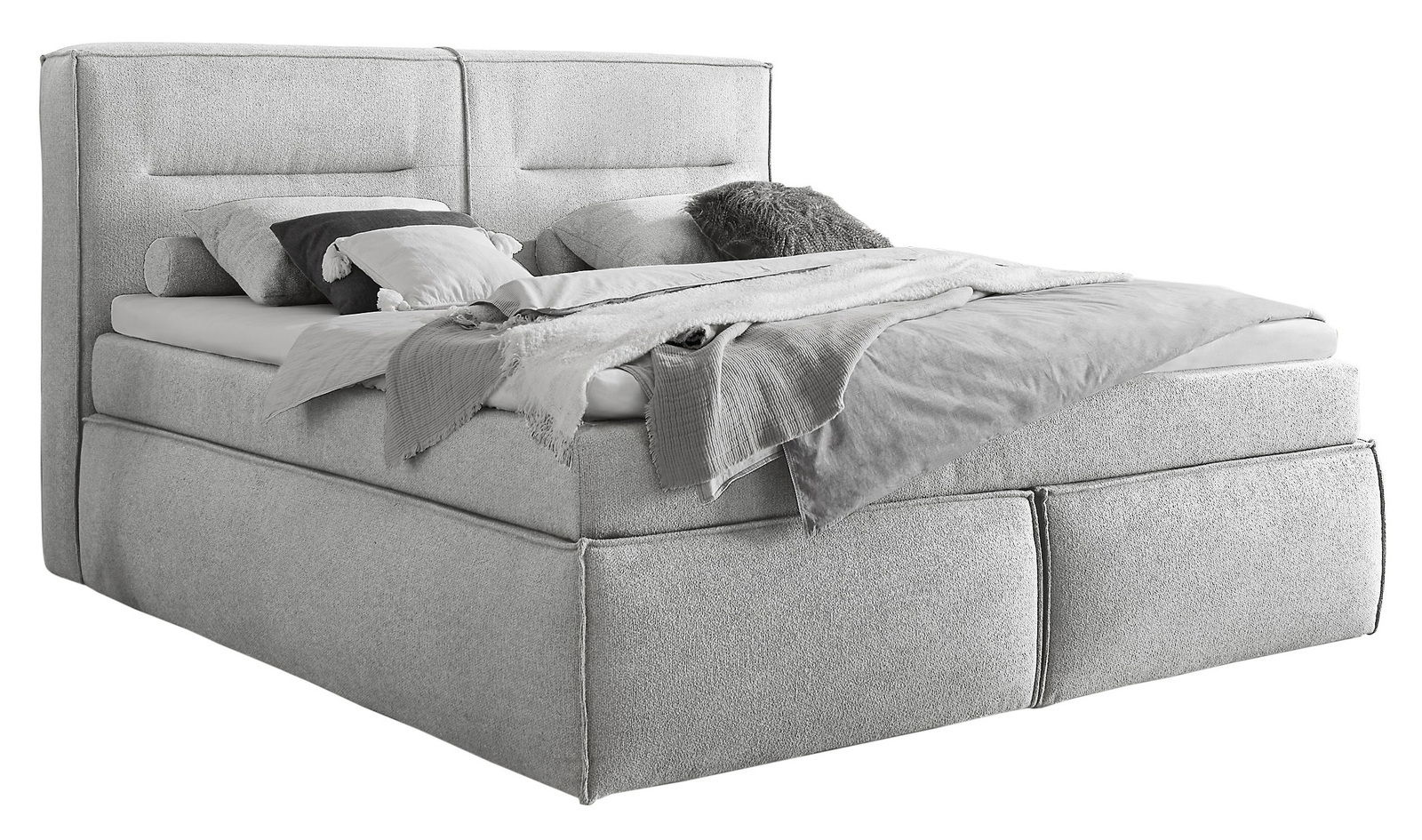 Graues Boxspringbett mit Kopfteil, seitlicher Blickwinkel