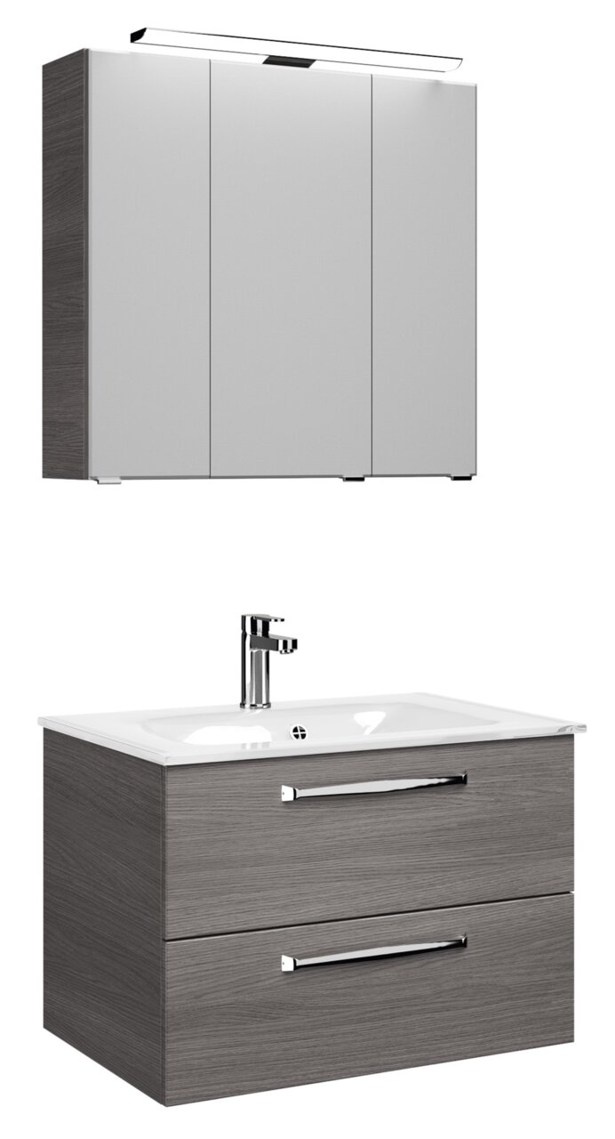 Pelipal Badblock TRENTINO Moderner Badblock mit grauem Holzfinish, bestehend aus einem Hängeschrank mit Spiegel und einem Waschtisch mit zwei Schubladen, seitliche Perspektive.