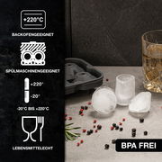 Eiswürfelform in Nahaufnahme, geeignet für Backofen und Spülmaschine, BPA-frei, mit runden Eiswürfeln und Getränkeglas.