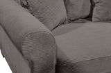 Nahaufnahme eines grauen Funktionssofas mit geripptem Stoffbezug, Blick auf die Armlehne und Sitzfläche.