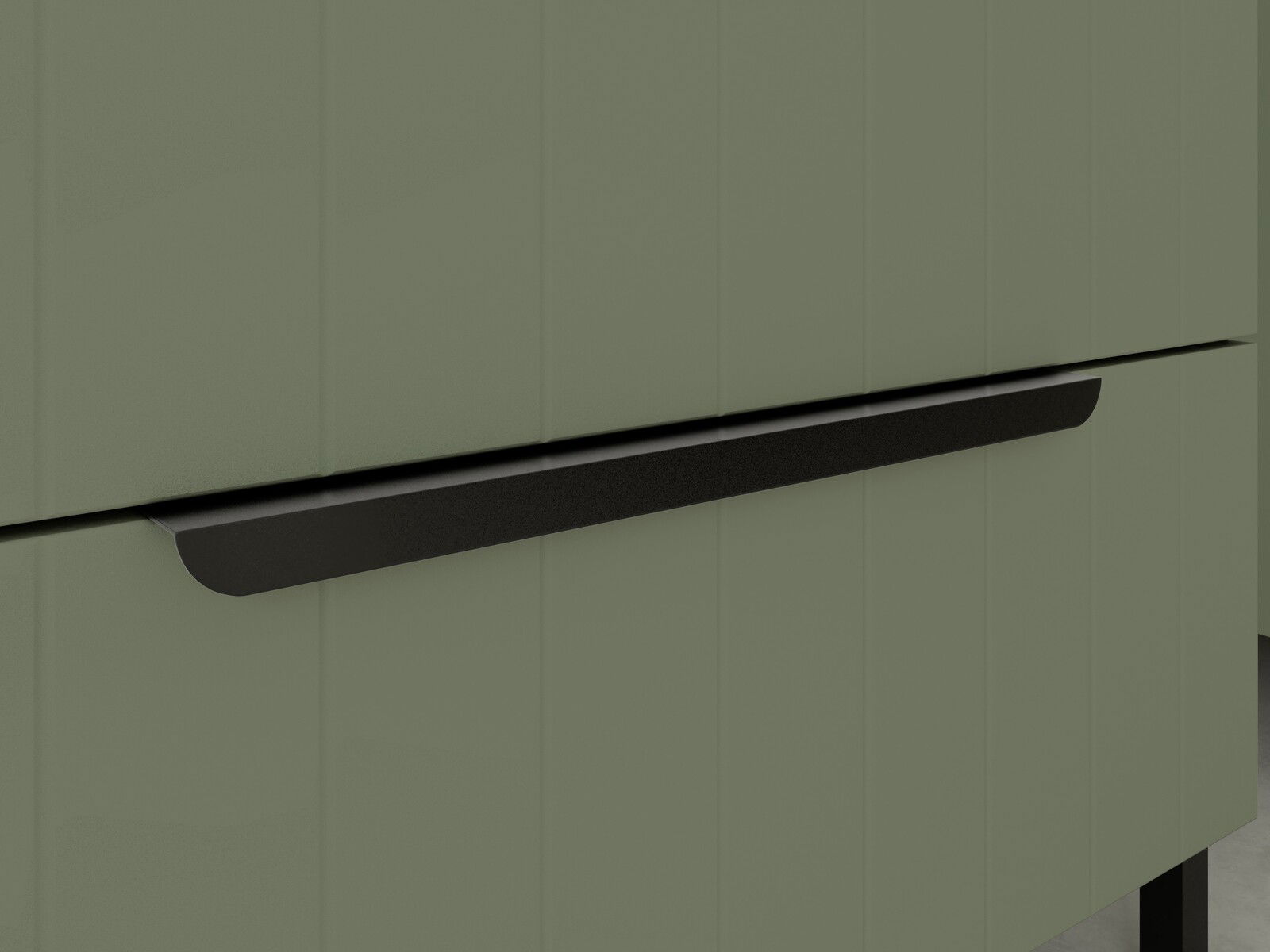 Nahaufnahme eines modernen, grünen Waschbeckenunterschranks mit schwarzem Griff, seitliche Perspektive.