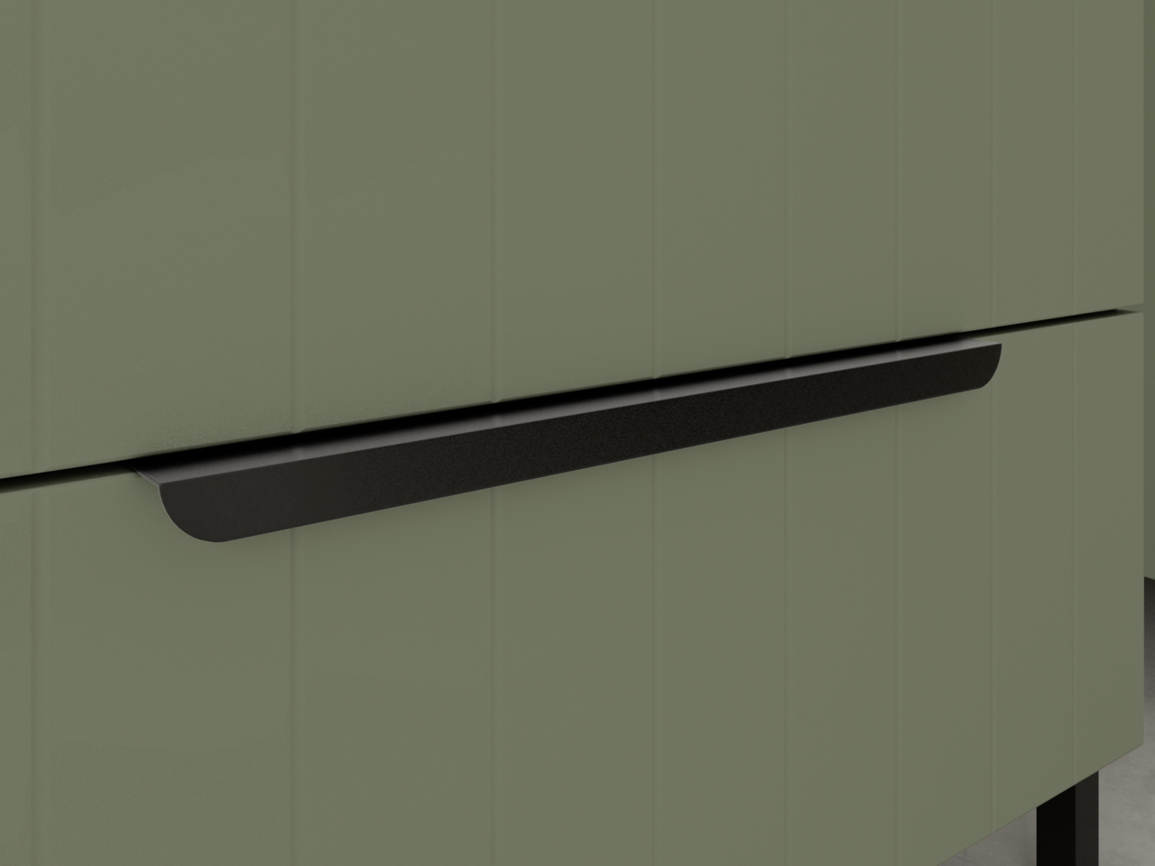 Nahaufnahme eines modernen, grünen Waschbeckenunterschranks mit schwarzem Griff, seitliche Perspektive.