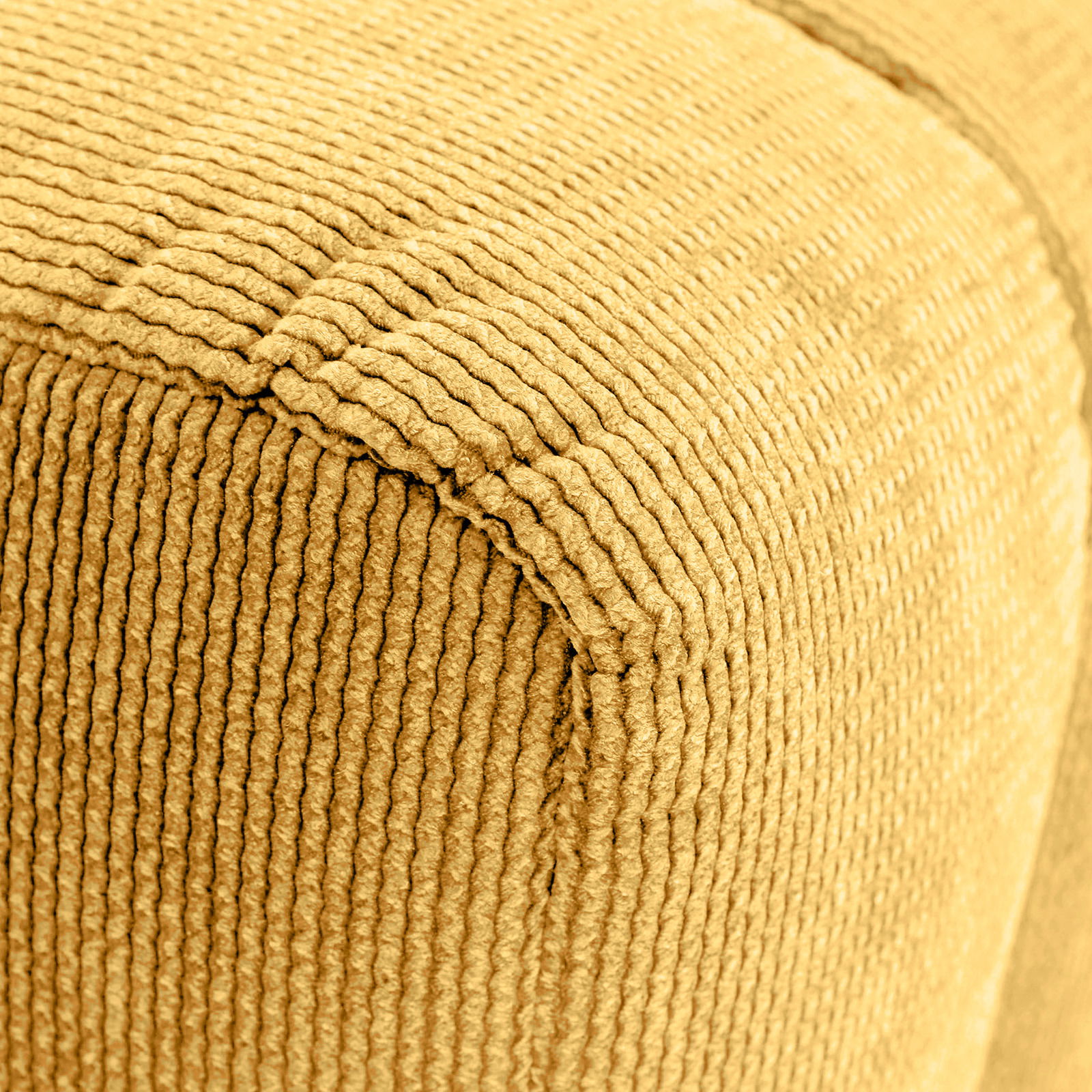 Novel Hocker LAILA Nahaufnahme eines gelben, strukturierten Hockers mit geripptem Stoffbezug, perspektivisch von der Seite aufgenommen.