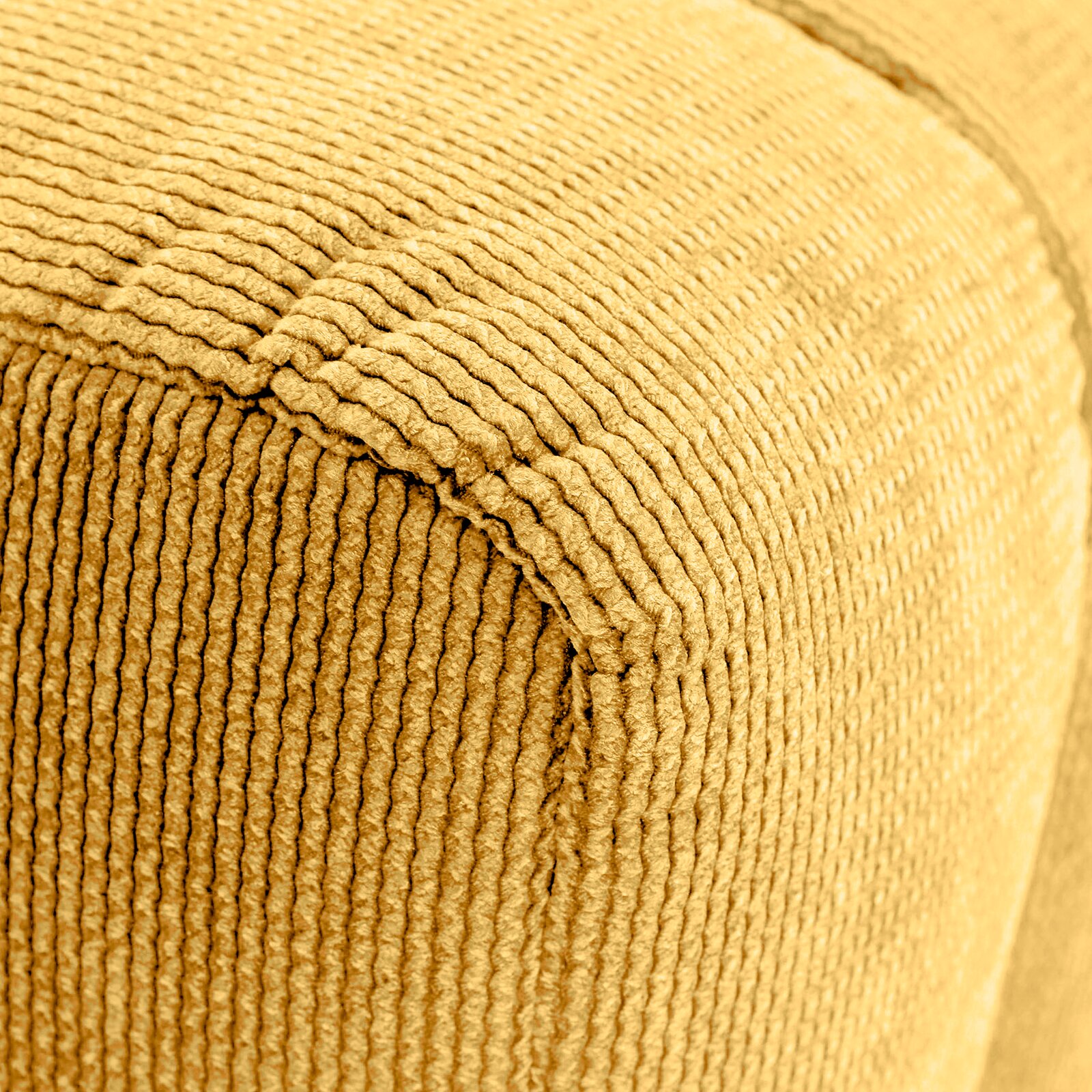 Novel Hocker LAILA Nahaufnahme eines gelben, strukturierten Hockers mit geripptem Stoffbezug, perspektivisch von der Seite aufgenommen.