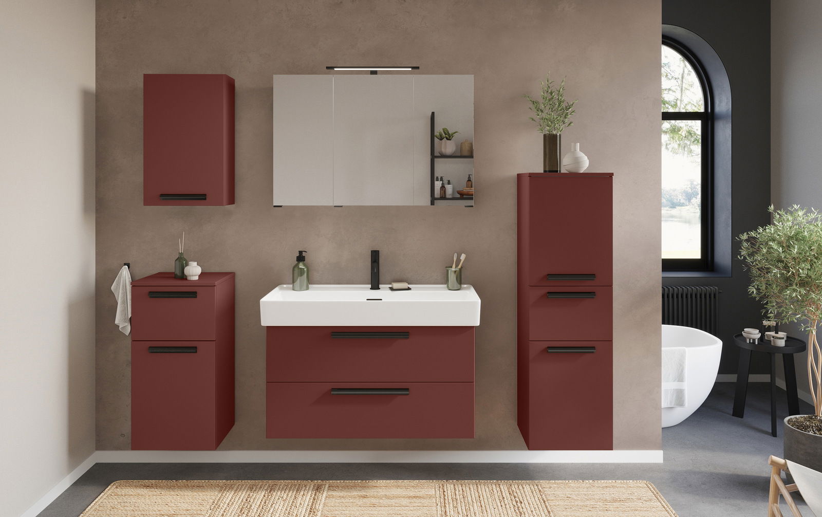 Frontale Ansicht eines modernen Waschtisch-Sets in einem Badezimmer mit roten Schränken, einem weißen Waschbecken und einem großen Spiegel.