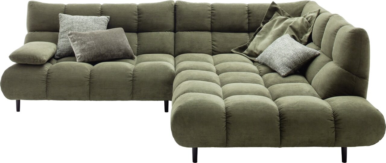 Pure Home Lifestyle Ecksofa Grüne Eckgarnitur mit Kissen, aus einer leicht erhöhten Perspektive fotografiert.