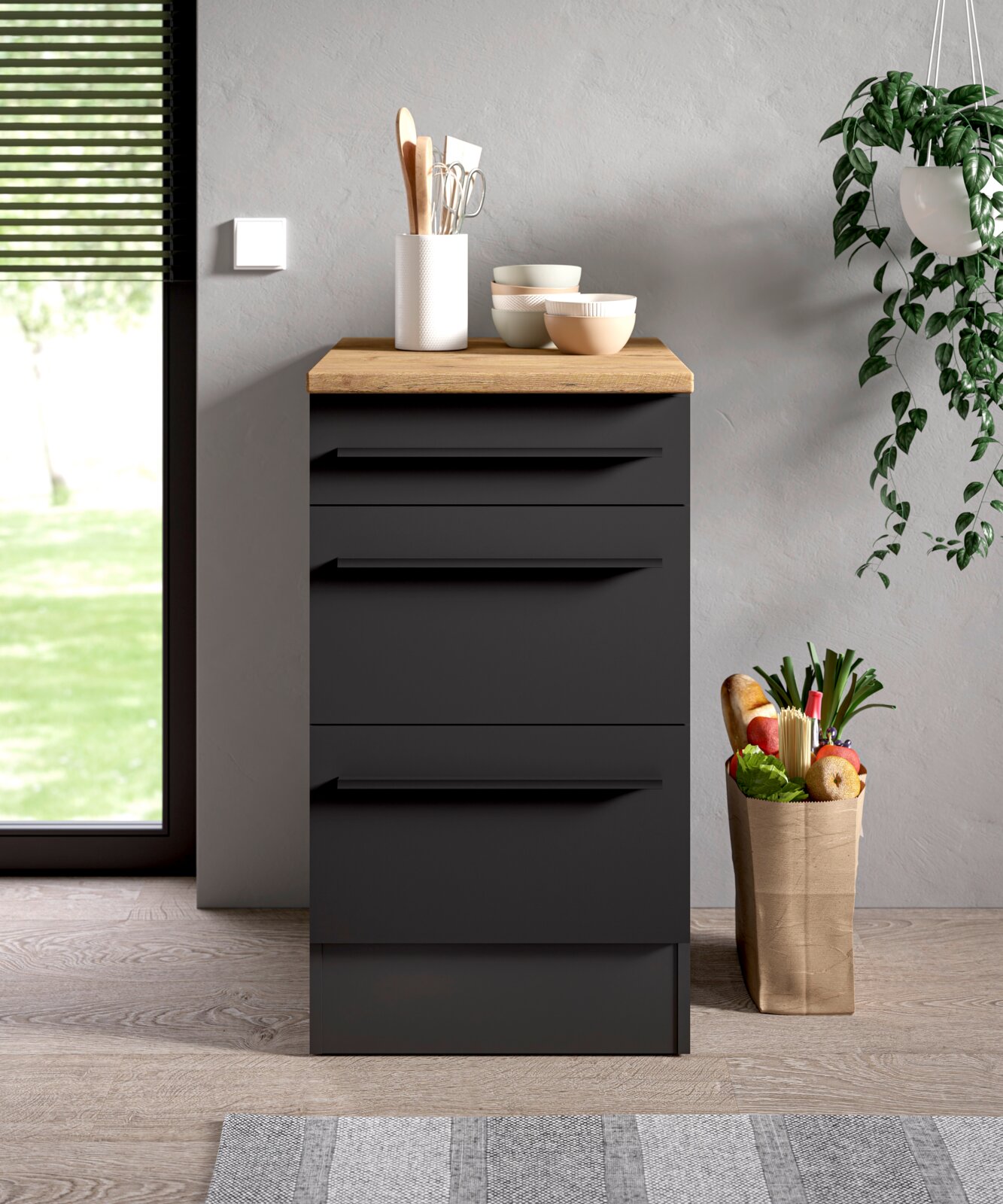 Moderner Unterschrank 50A in dunklem Design mit Holzarbeitsplatte, frontal abgebildet in einer stilvollen Küchenecke.
