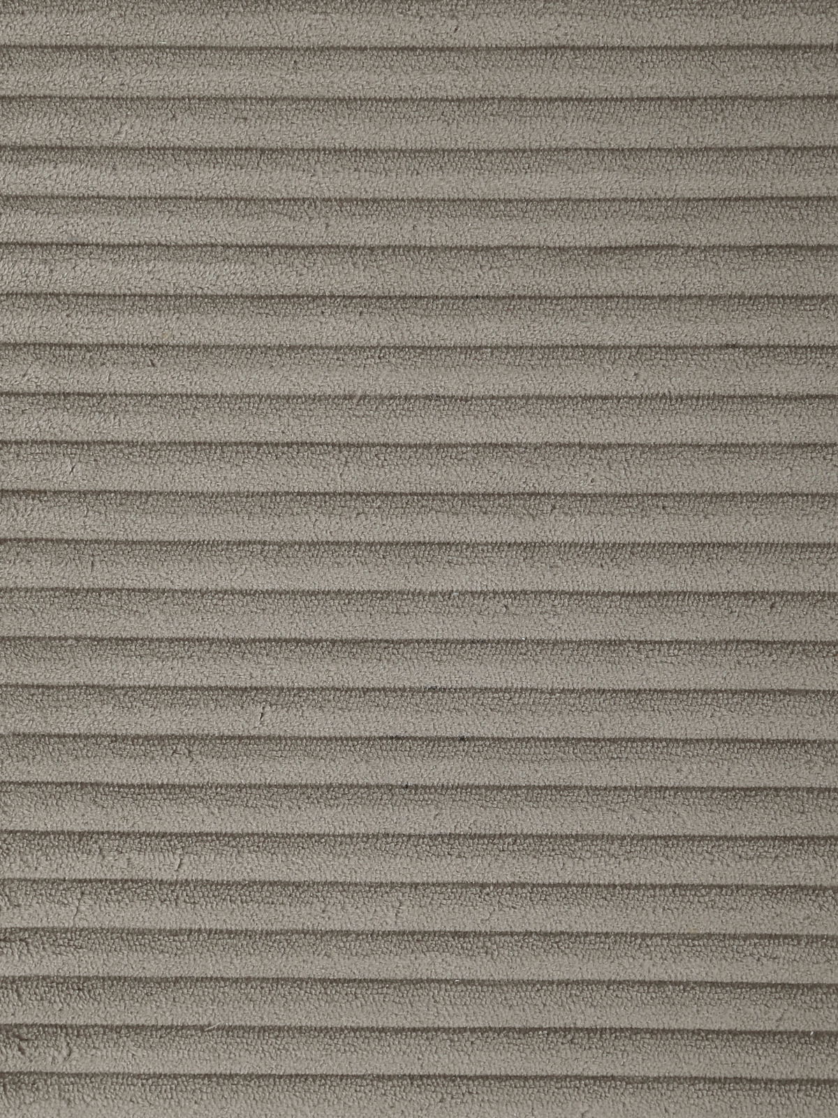 Nahaufnahme eines grauen, gerippten Stoffes, der für einen Schwingstuhl verwendet wird, aus der Vogelperspektive.