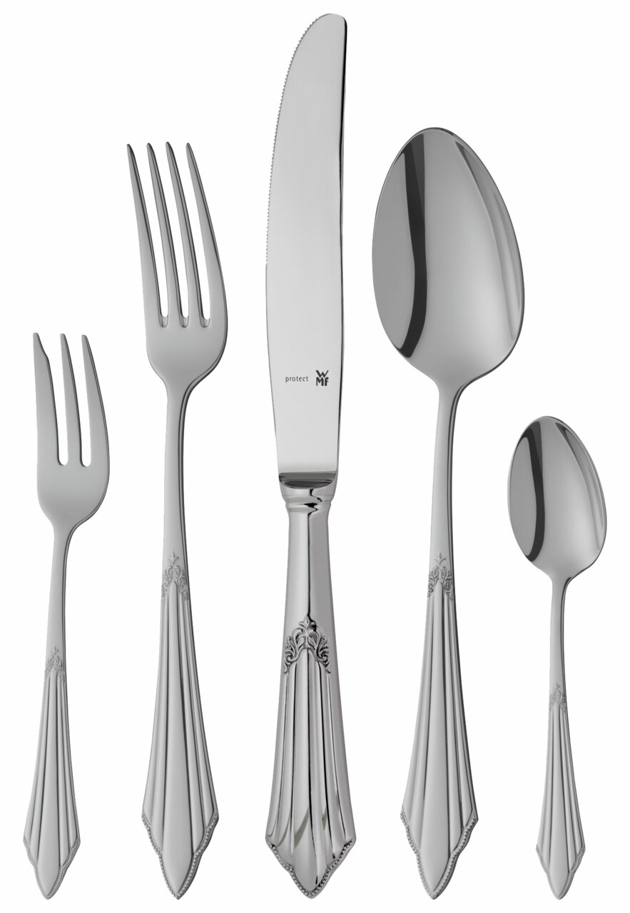 Elegante bestekset met decoratieve handvatten, bestaande uit een vork, mes, eetlepel, theelepel en taartvork, gefotografeerd vanuit vogelperspectief.