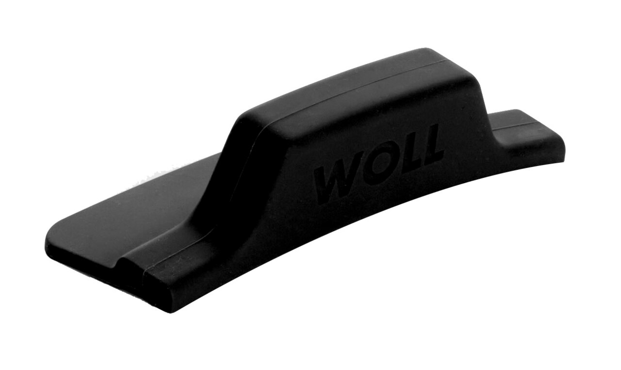 Zijaanzicht van een grijze, hoekige siliconenhandgreep met het opschrift 'WOLL'.
