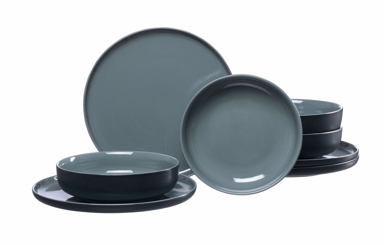 Tafel-Set Jasper 8-tlg. in Schwarz, bestehend aus verschiedenen Tellern und Schalen, aus seitlicher Perspektive fotografiert.