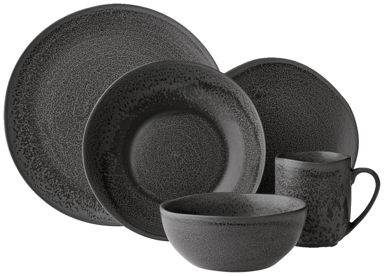 Schwarzes Kombiservice 20-teilig mit Tellern, Schalen und Tasse, Ansicht von vorne.