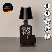 Akku-Tischleuchte in Form einer Flasche mit der Aufschrift 'Gintastic', schwarze Farbe, seitliche Ansicht, hergestellt in Deutschland.