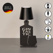 Akku-Tischleuchte in Form einer Flasche mit der Aufschrift 'Gintastic', schwarze Farbe, seitliche Ansicht, hergestellt in Deutschland.