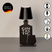 Accu-tafellamp in de vorm van een fles met het opschrift 'Gintastic', zwarte kleur, zijaanzicht, vervaardigd in Duitsland.