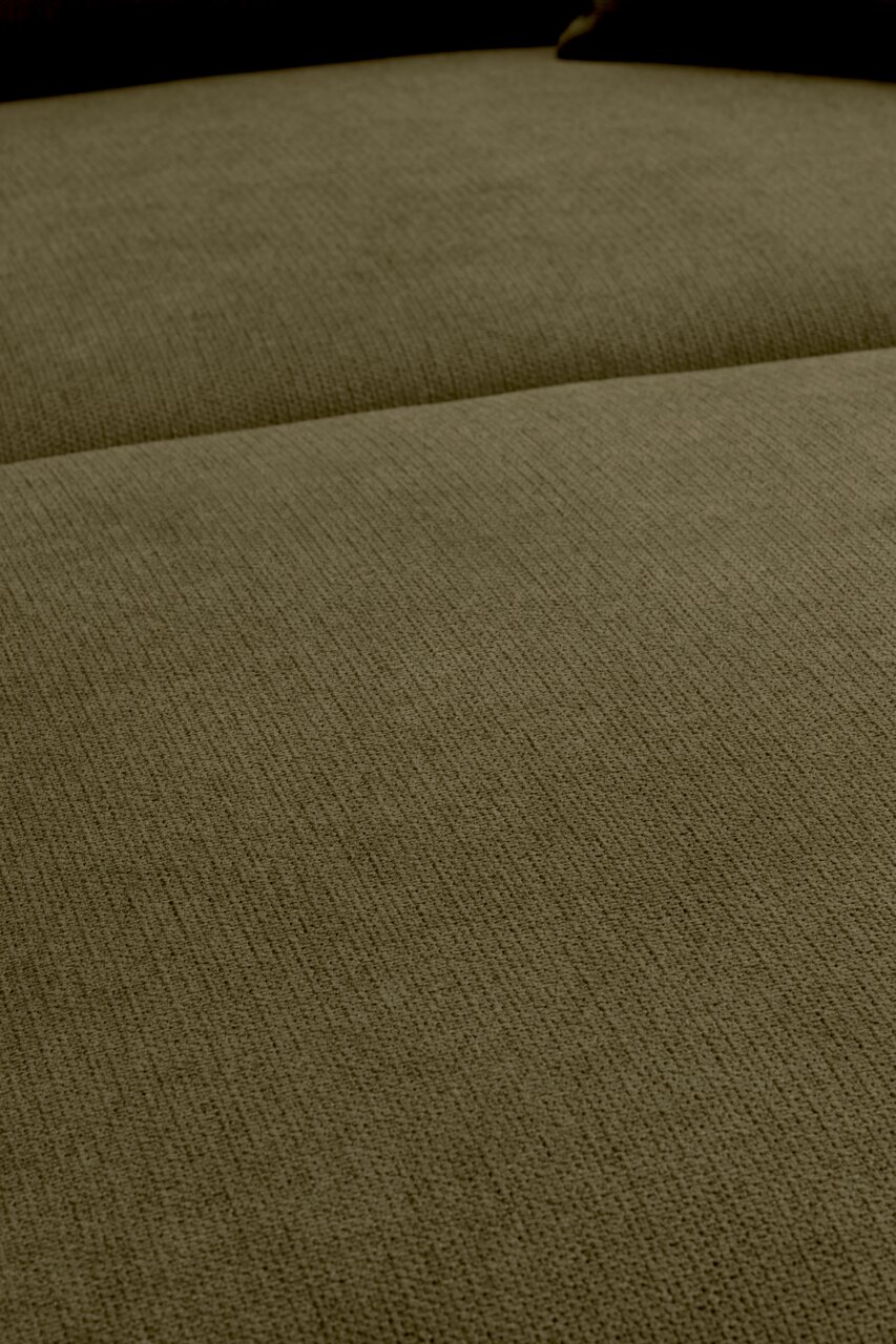 Close-up van een beige, grof geweven bekledingsoppervlak met zichtbare naad; perspectief: licht schuin van bovenaf.
