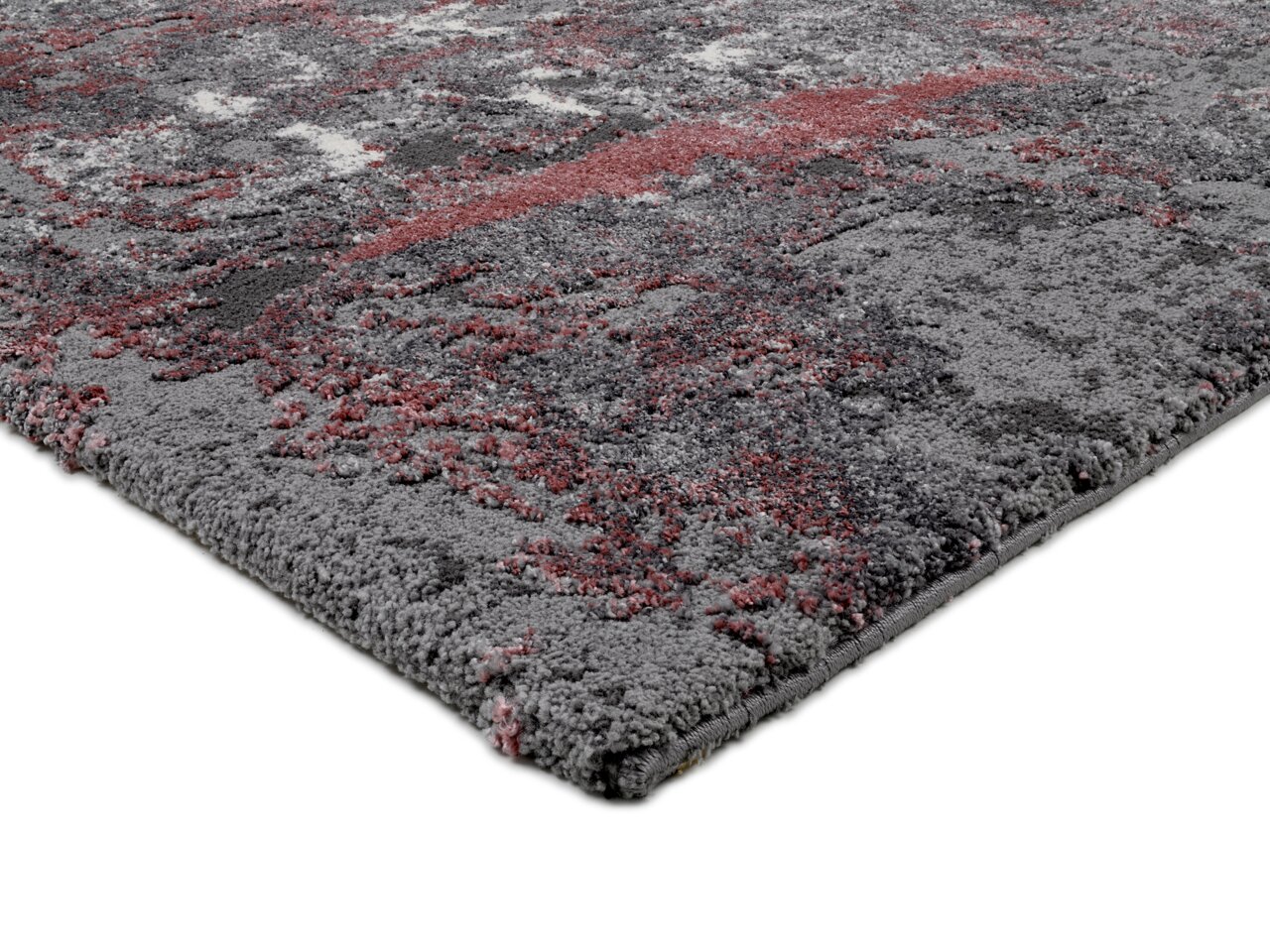 Designer Teppich in Grau- und Rottönen, Nahaufnahme aus seitlicher Perspektive