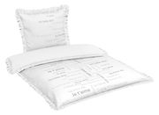 Bettwäsche-Set mit Kissen und Decke, bedruckt mit 'Ich liebe dich' in verschiedenen Sprachen, von schräg oben fotografiert.